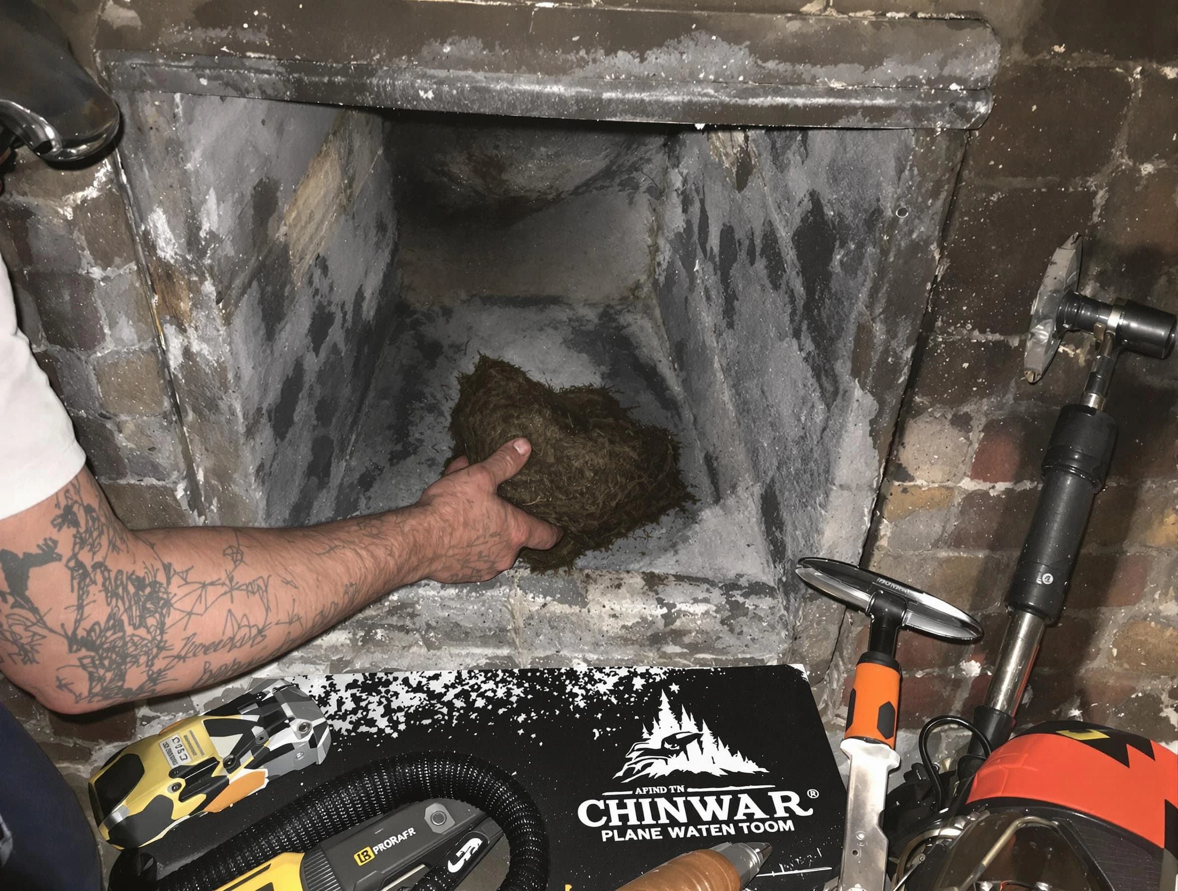 Helena Chimney Sweep safely removing debris and screening chimney in Helena, AL